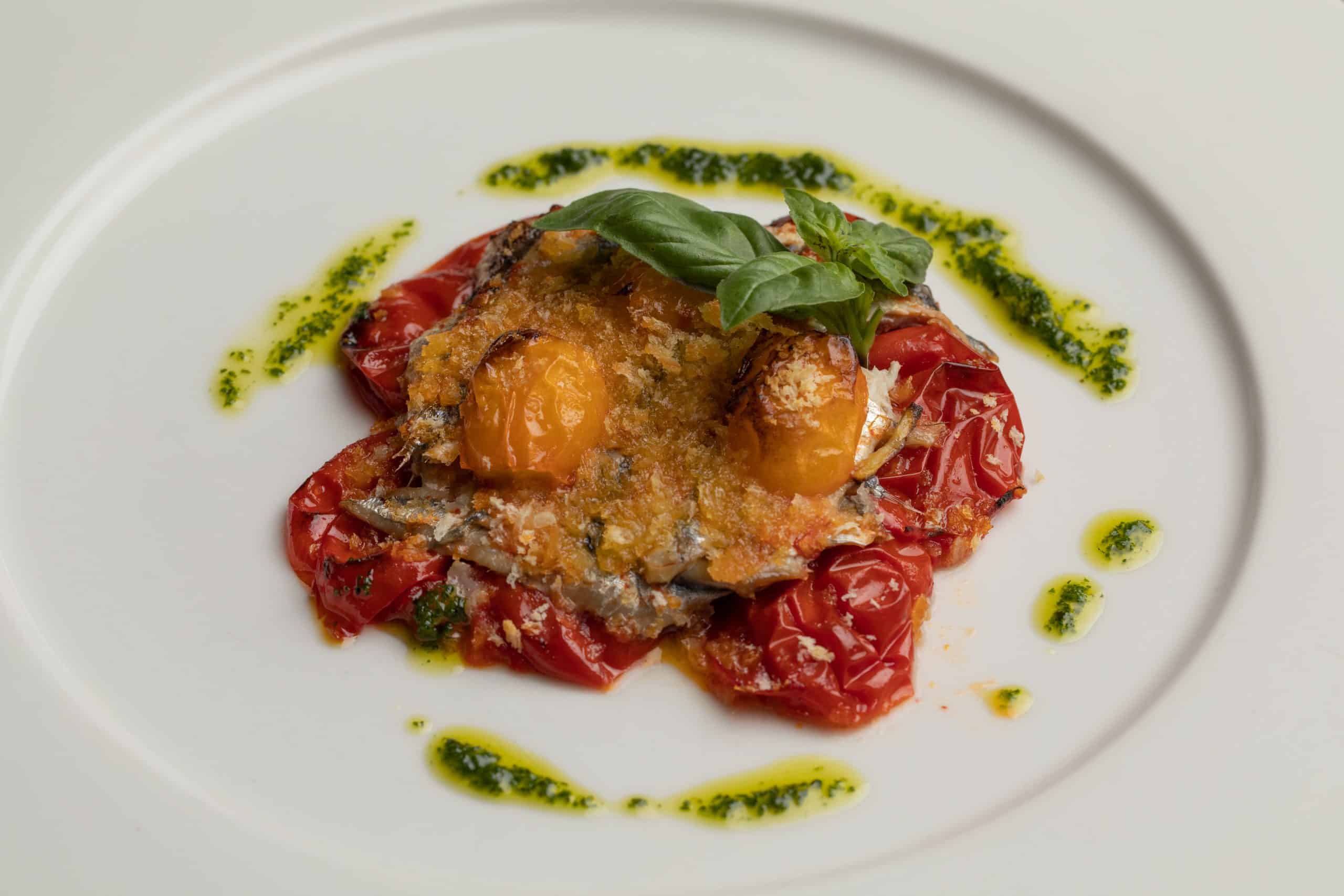 BAKED ANCHOVIES AU GRATIN WITH IGP COSTOLUTO TOMATOES